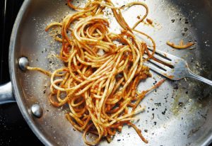 Leftover Spaghetti in Frying Pan --- Image by © Radius Images/Corbis